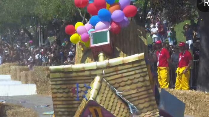 A crashed soapbox cart mid-broadcast in the bottom-left tile.